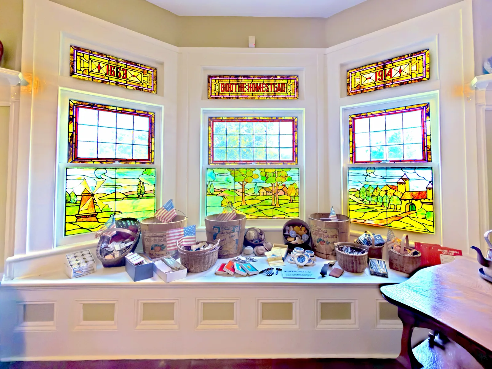 Boothe Homestead interior with stained-glass windows and museum displays