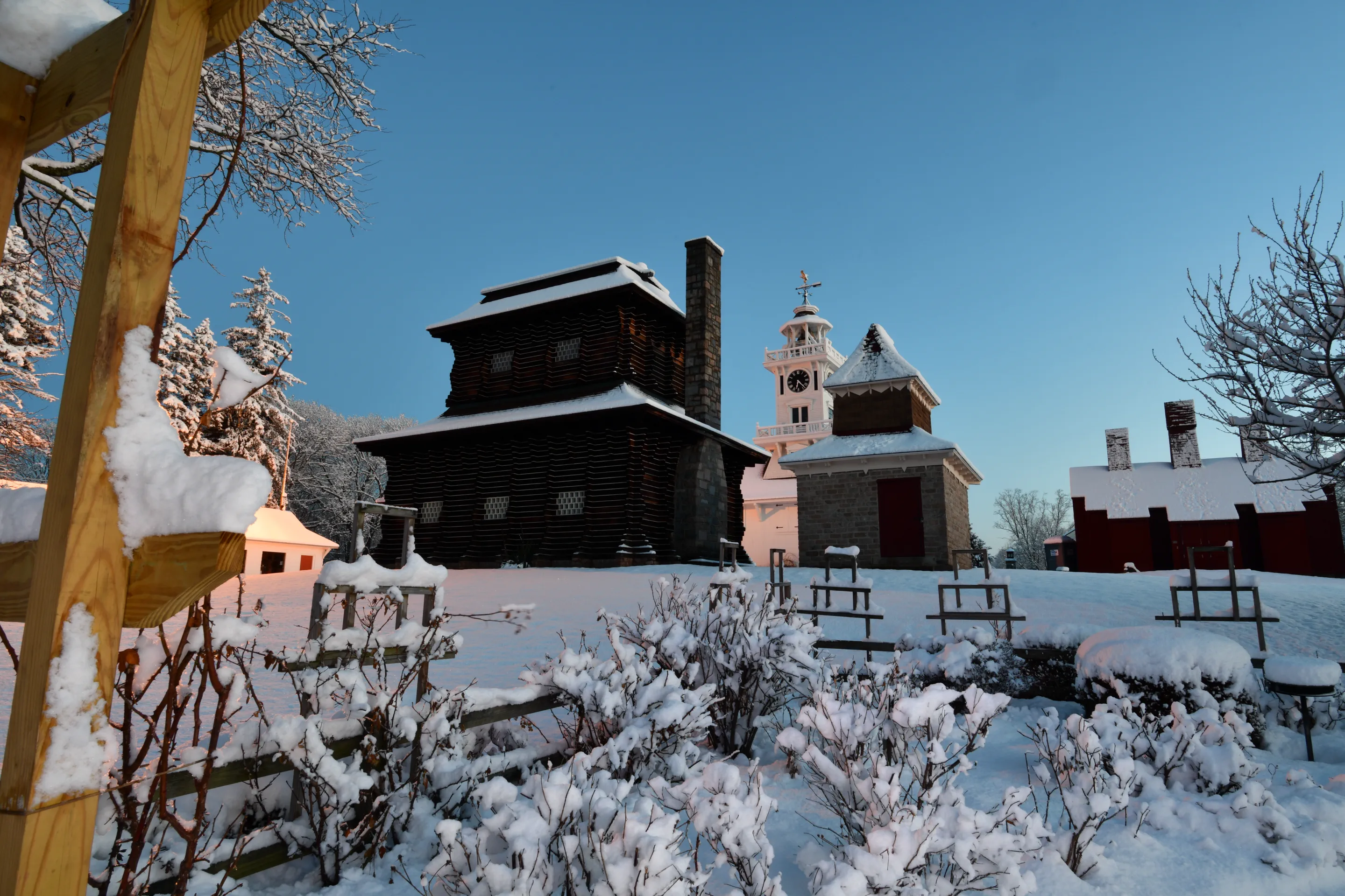 Redwood Building and Clocktower Museum after a snowfall at sunset