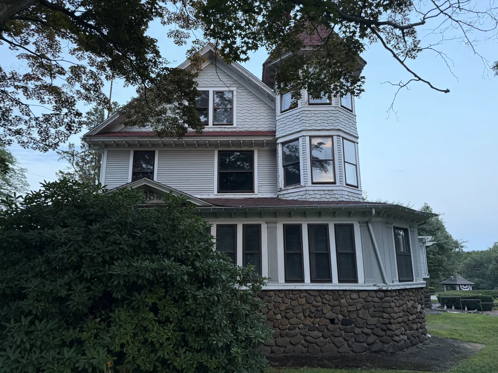 Front corner of Stephen Boothe House with Queen Anne bay windows and shingle detailing