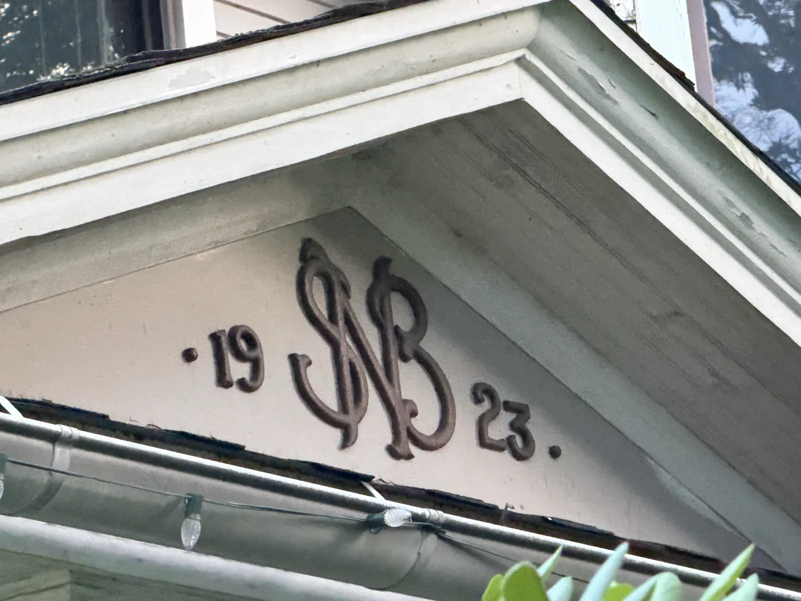 Decorative SB monogram with the numerals 19 and 23 beneath the eaves of Stephen Boothe House