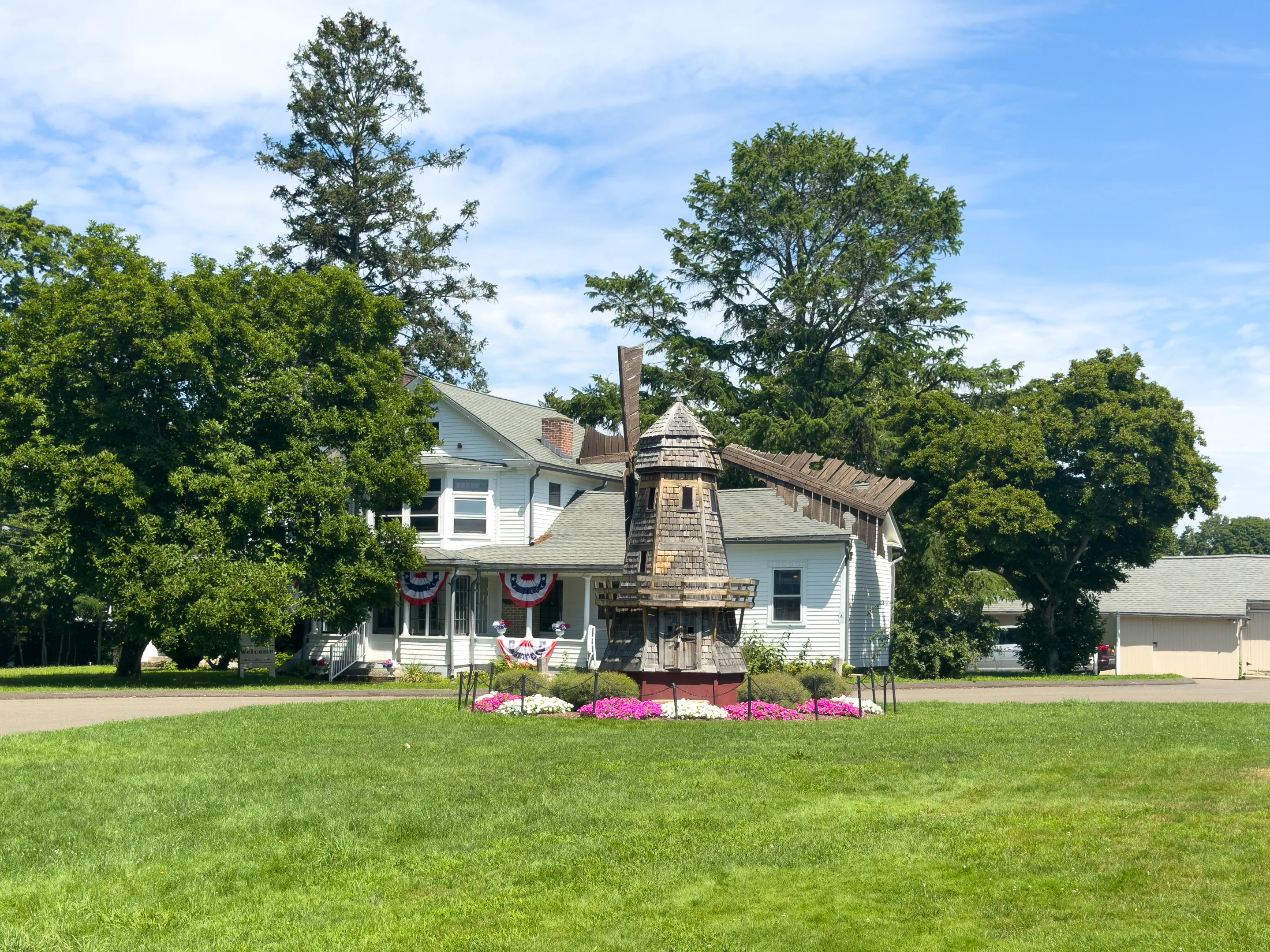 Boothe Park miniature windmill with the Clocktower Museum beyond it